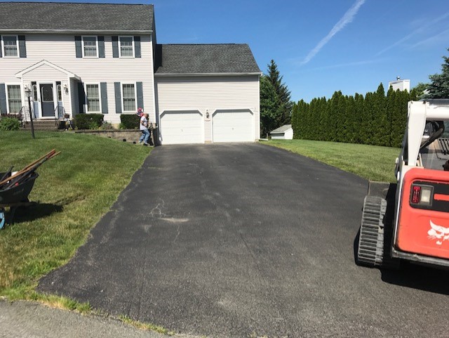 A newly replaced driveway, paved by Christopher's Paving LLC